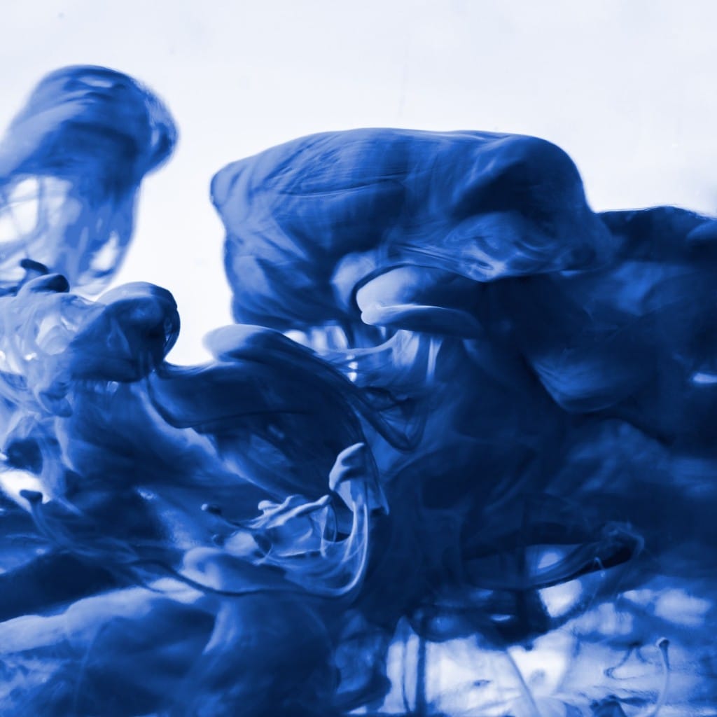 Abstract blue ink diffusing in water—premium fluid texture.